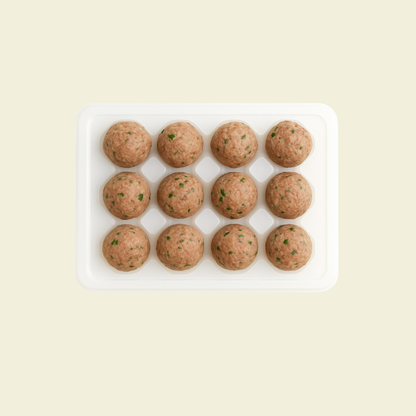 Frozen aged mandarin peel beef balls arranged in packaging, 12 pieces per pack