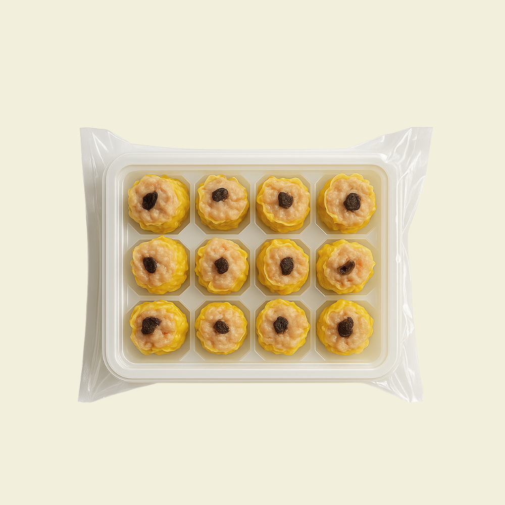 Frozen black truffle chicken shumai arranged in packaging, 12 pieces per pack