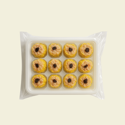 Frozen black truffle chicken shumai arranged in packaging, 12 pieces per pack
