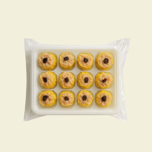 Frozen black truffle chicken shumai arranged in packaging, 12 pieces per pack